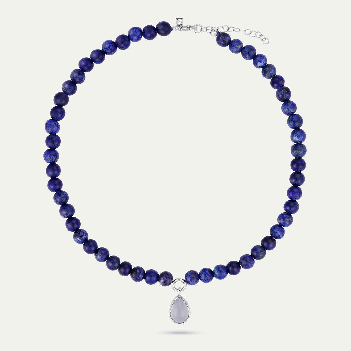 Necklace with blue beads and a silver pendant on a white background