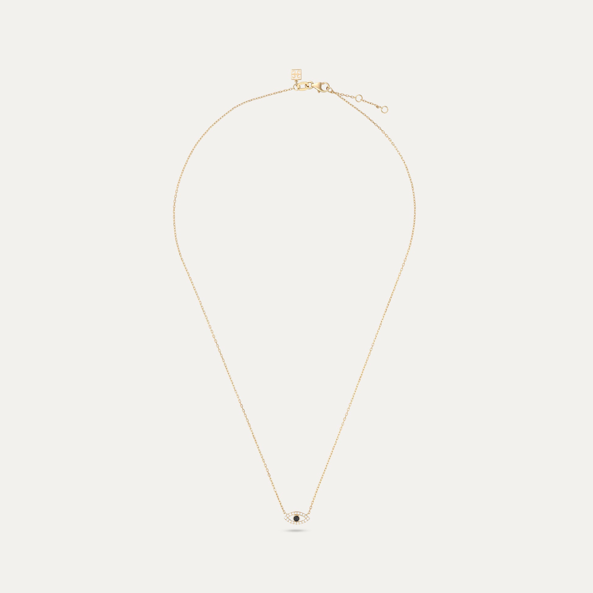 Gold necklace with a small pendant on a white background