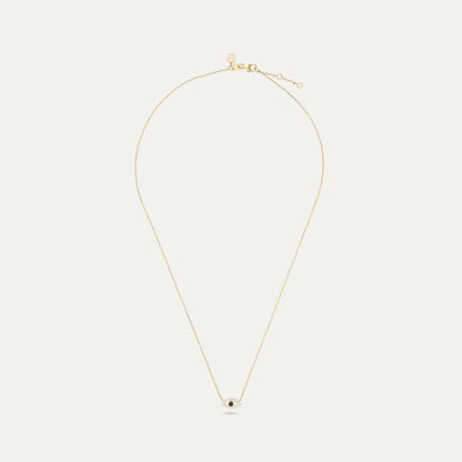 Gold necklace with a small pendant on a white background