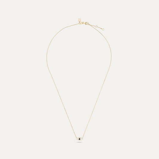 Gold necklace with a small pendant on a white background