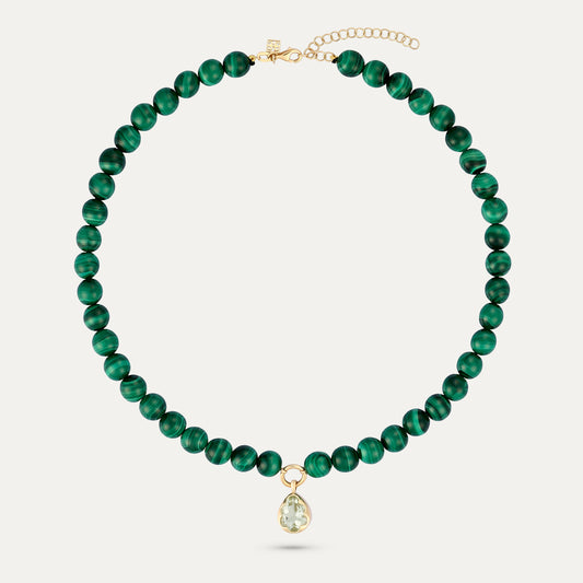 Green beaded necklace with a gold clasp on a white background
